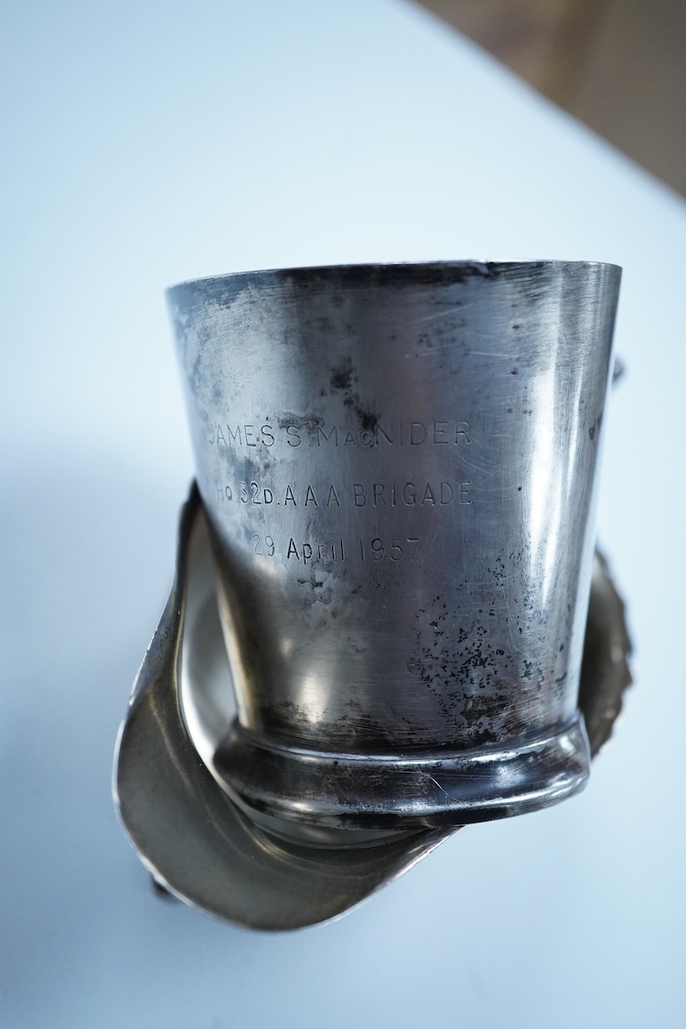 A George V silver sauceboat, by William Neale Ltd, Birmingham, 1925, length 14.6cm, together with a 1950's small silver mug, 6.6oz.